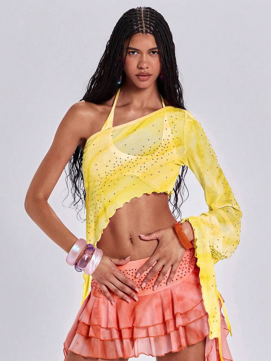 Women's one shoulder crop top featuring an asymmetrical long sleeve, colorful print, and sparkling rhinestone embellishments.