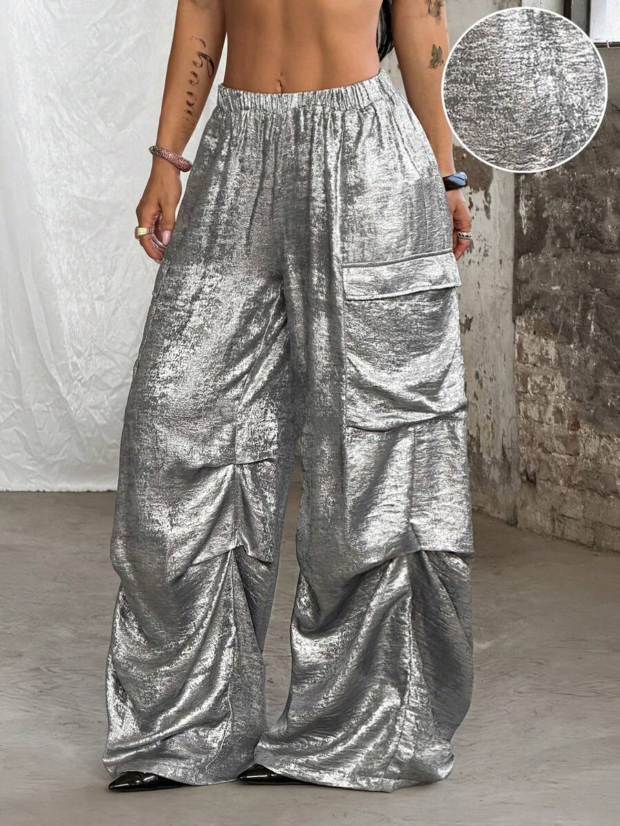 Women's high waist wide leg cargo pants featuring a black and white tree branch print and adjustable drawstring closure.