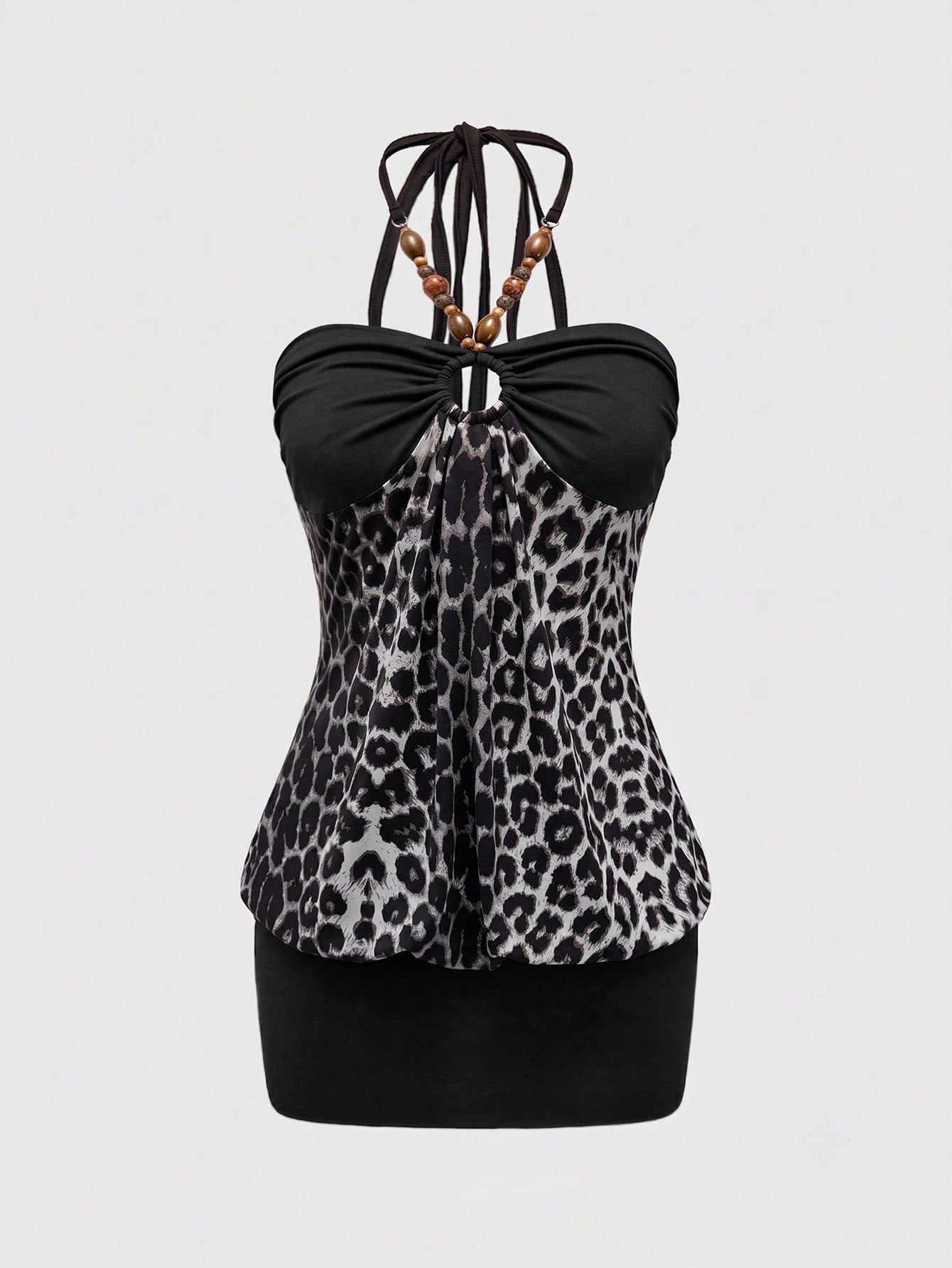 Women's Y2K halter neck leopard print bodycon mini dress with beaded decor, patchwork design, backless knot detail, slim fit, and sleeveless mini length.