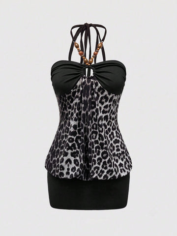 Women's Y2K halter neck leopard print bodycon mini dress with beaded decor, patchwork design, backless knot detail, slim fit, and sleeveless mini length.