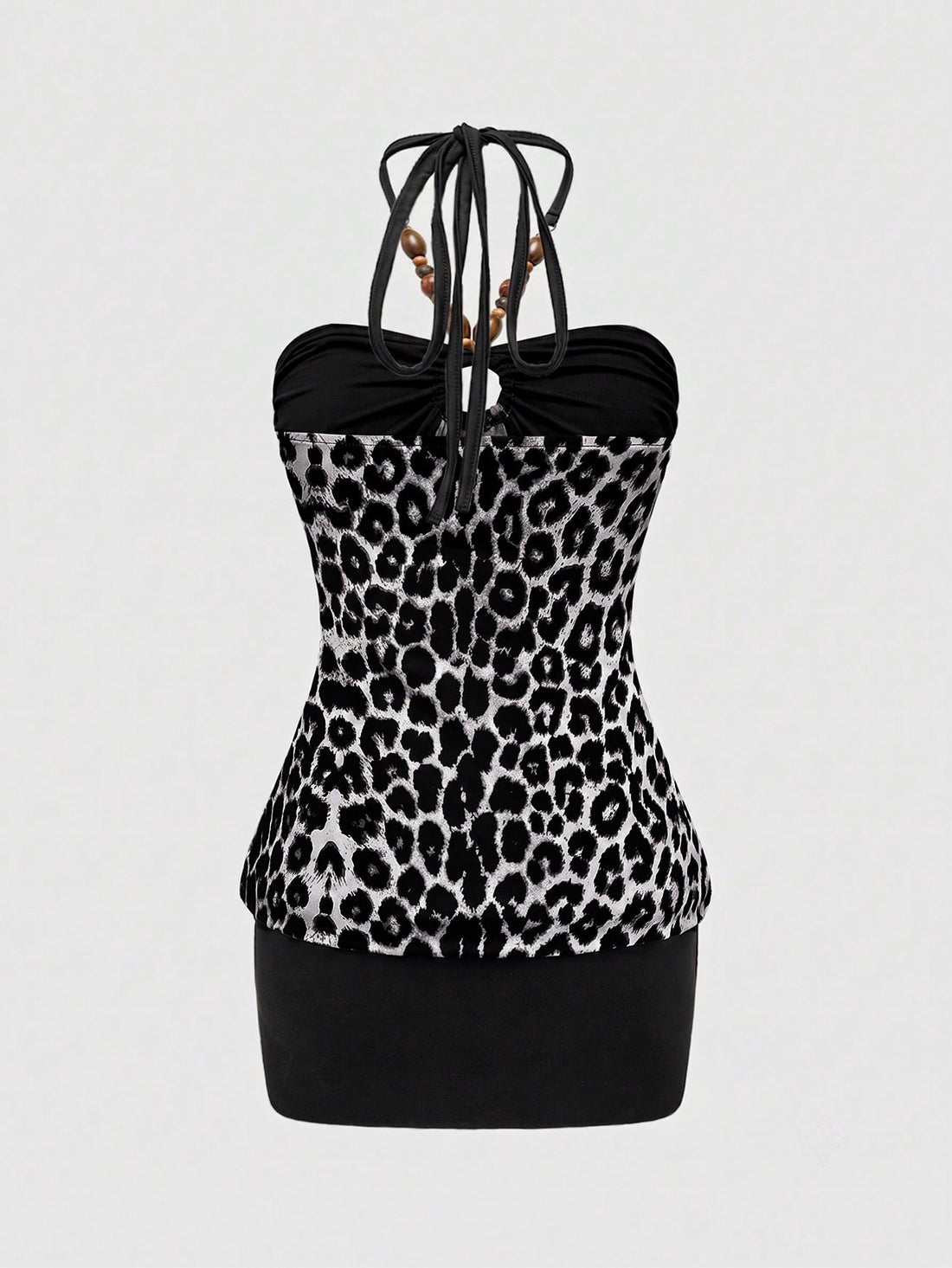 Women's Y2K halter neck leopard print bodycon mini dress with beaded decor, patchwork design, backless knot detail, slim fit, and sleeveless mini length.