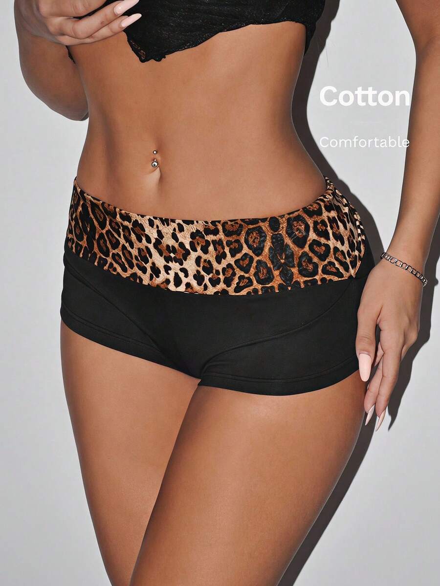 Leopard print foldover waist ultra low rise mini shorts with elastic waistband, skinny fit, and short length.