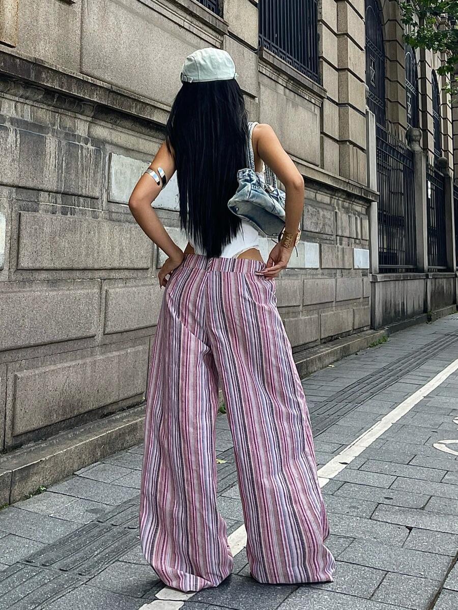 Women's casual straight leg striped woven pants featuring a low waist and zipper fly closure.