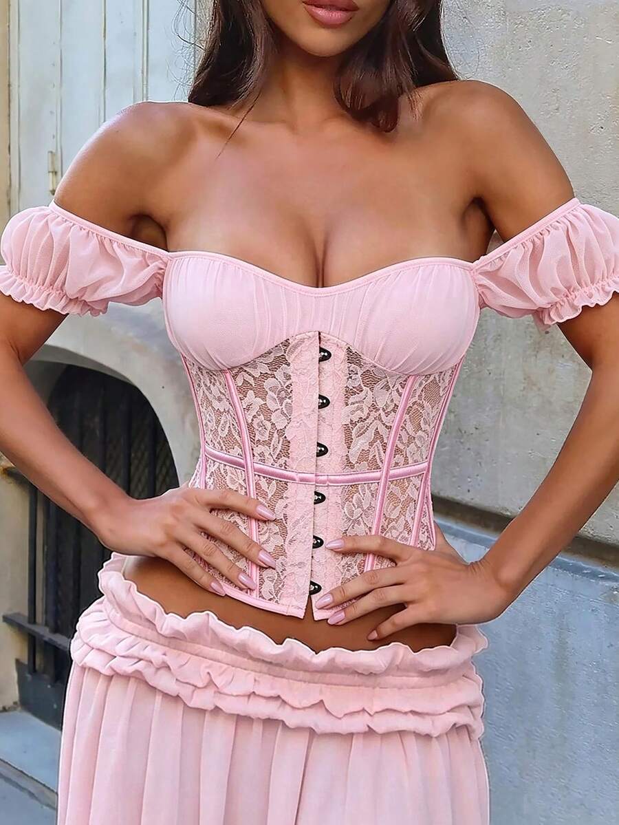 Front view of a vintage lace corset crop top featuring boned structure, square neckline, and lace-up details.