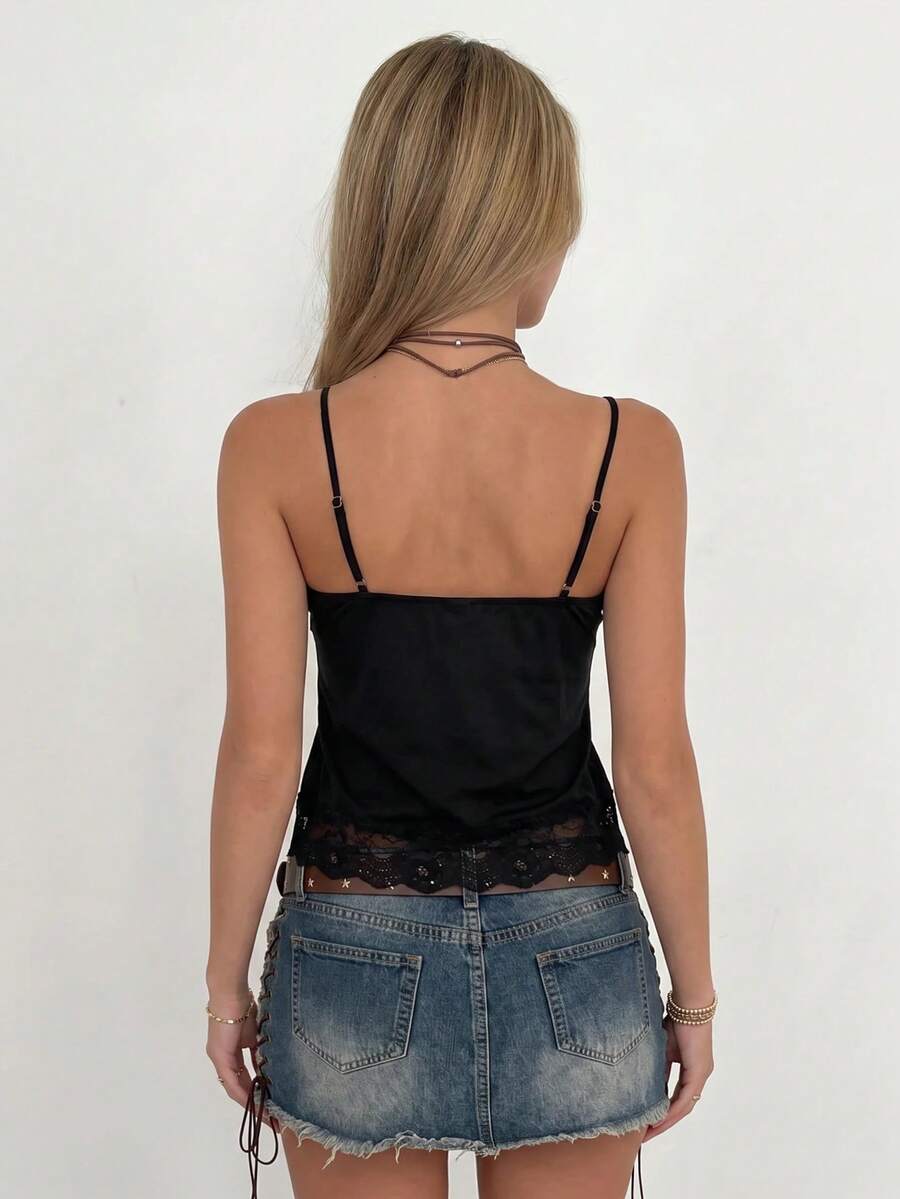 Black women's spaghetti strap cami tank top with contrast lace patchwork, slim fit, short length, and semi-sheer knitted fabric