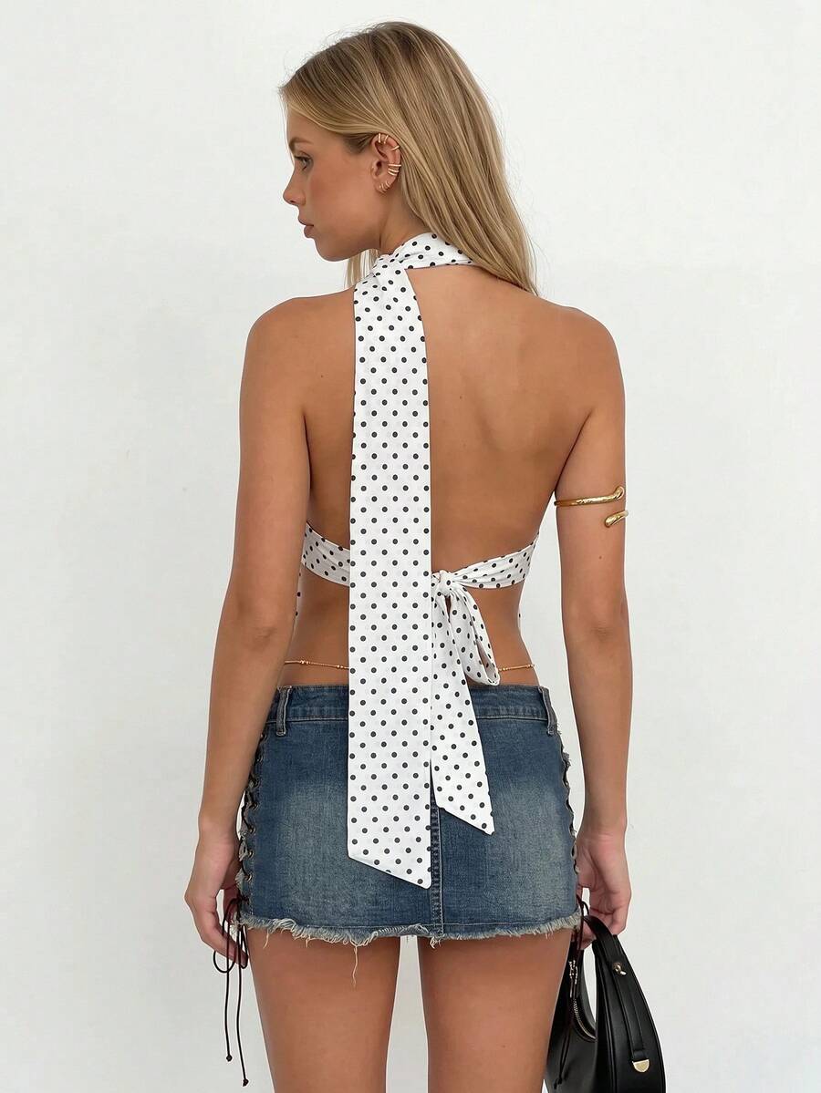 Women's polka dot halter tank top featuring neck straps, a backless tie-back design, regular hem, loose fit, and woven polyester fabric.