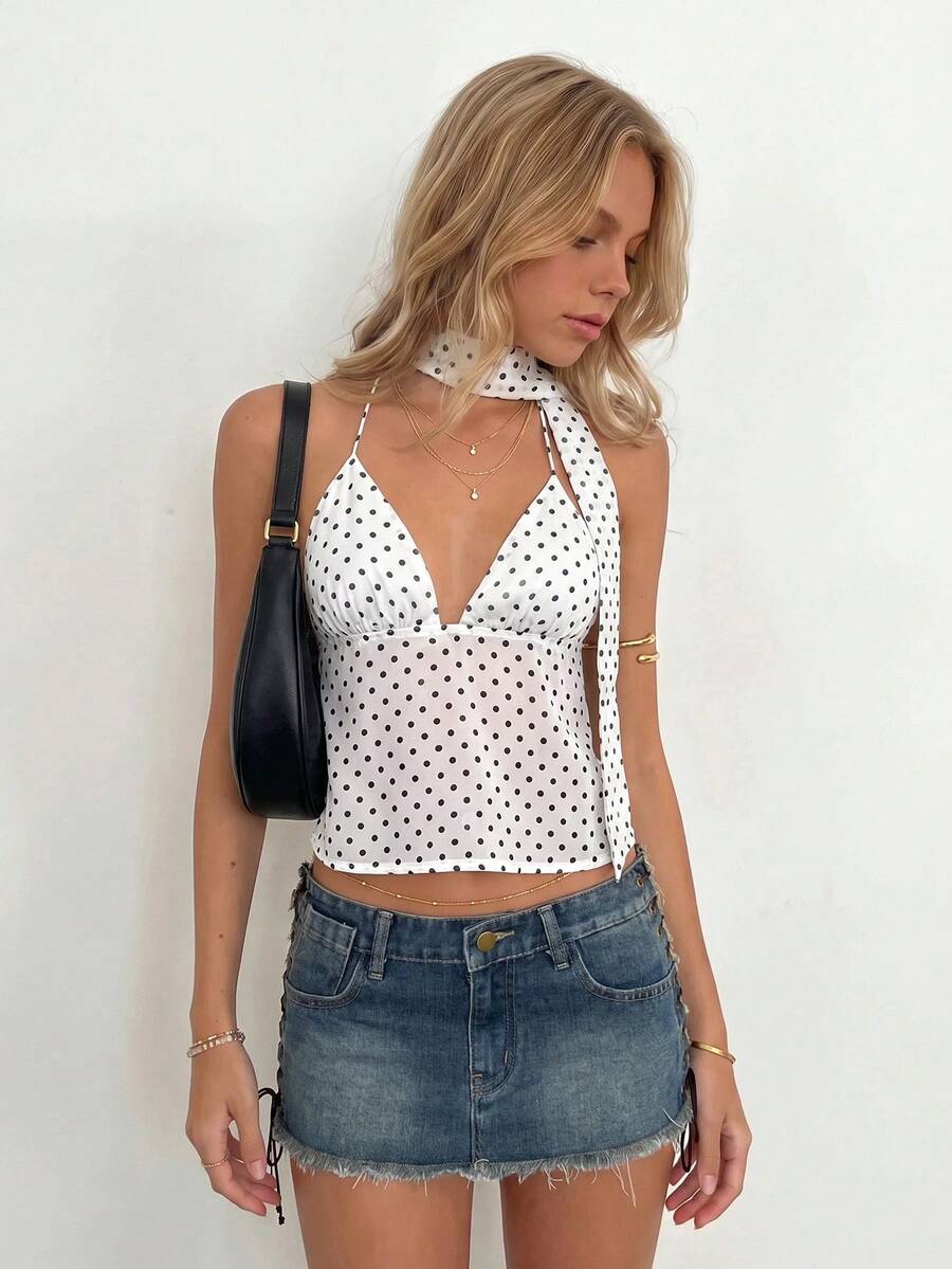 Women's polka dot halter tank top featuring neck straps, a backless tie-back design, regular hem, loose fit, and woven polyester fabric.