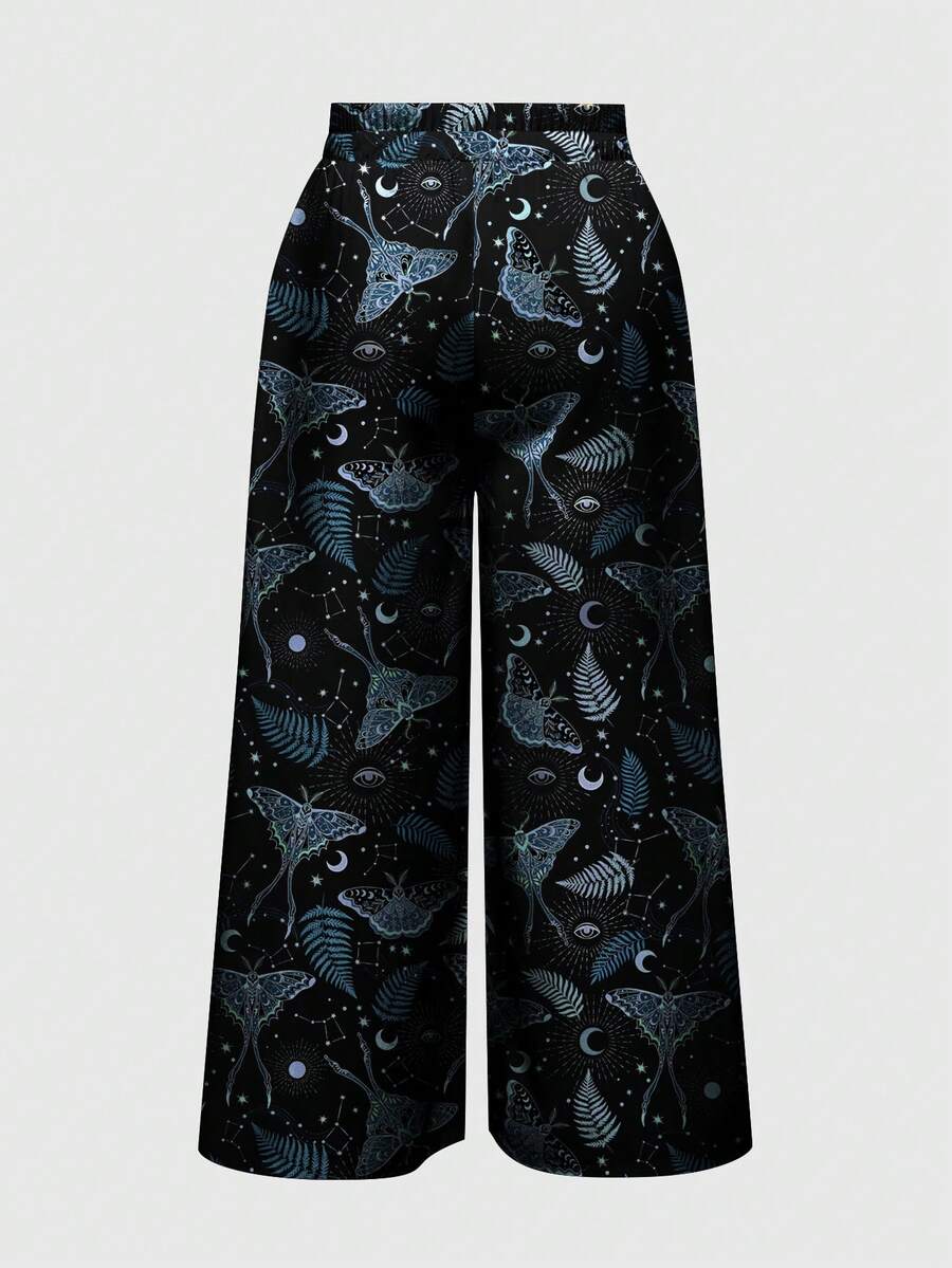 Women's plus size black gothic wide leg pants with split thigh detail and celestial moth, sun, and star pattern.