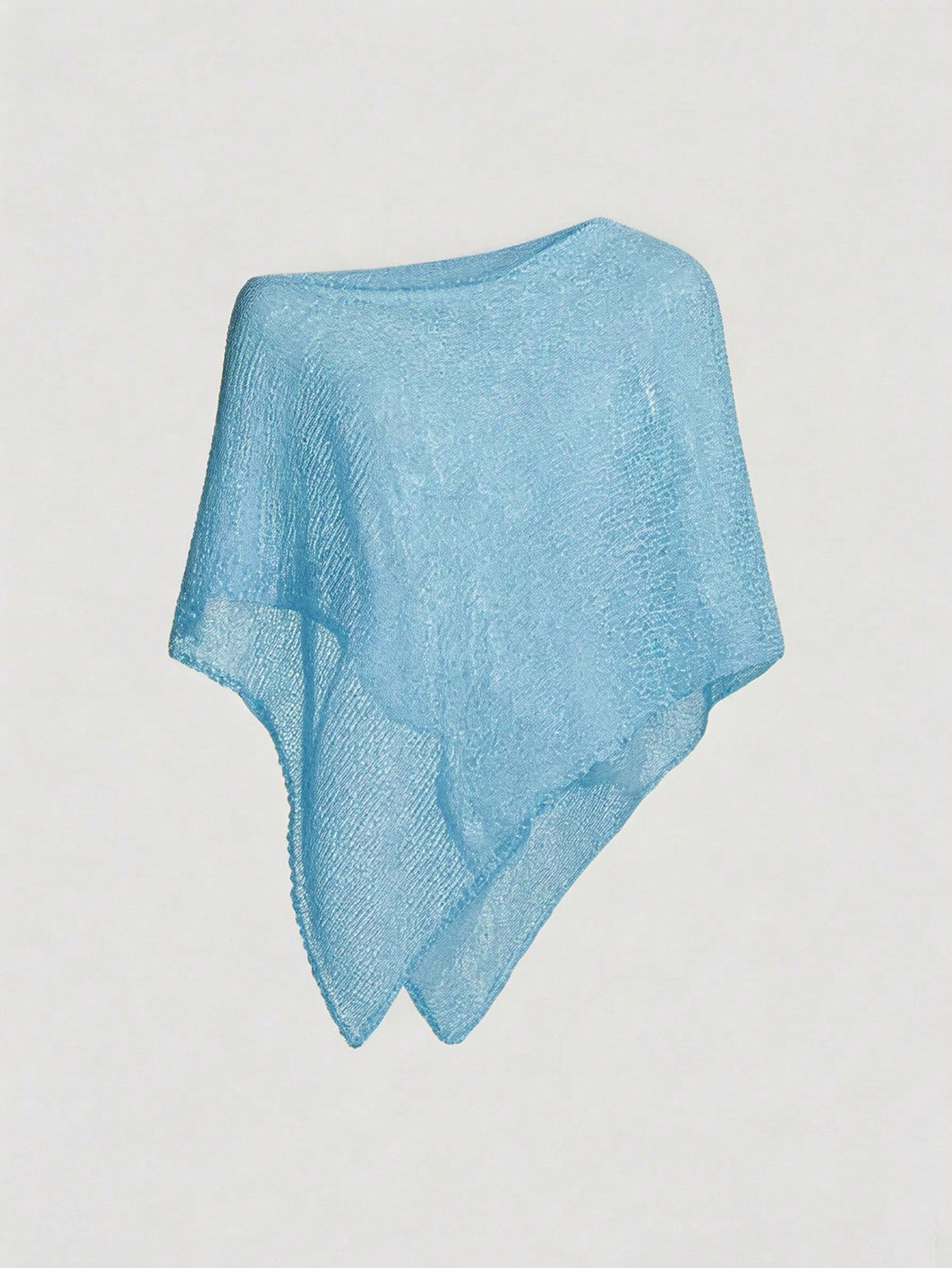 Women's casual hollow knit poncho top with boat neck, cloak sleeves, and asymmetrical hem