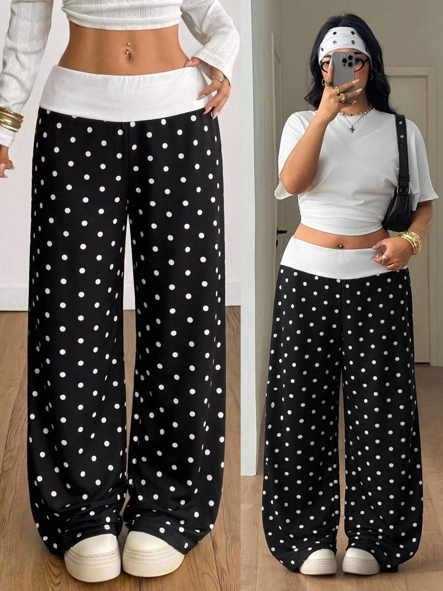 Women's casual straight leg sweatpants featuring a black and white polka dot design with an elastic waistband.