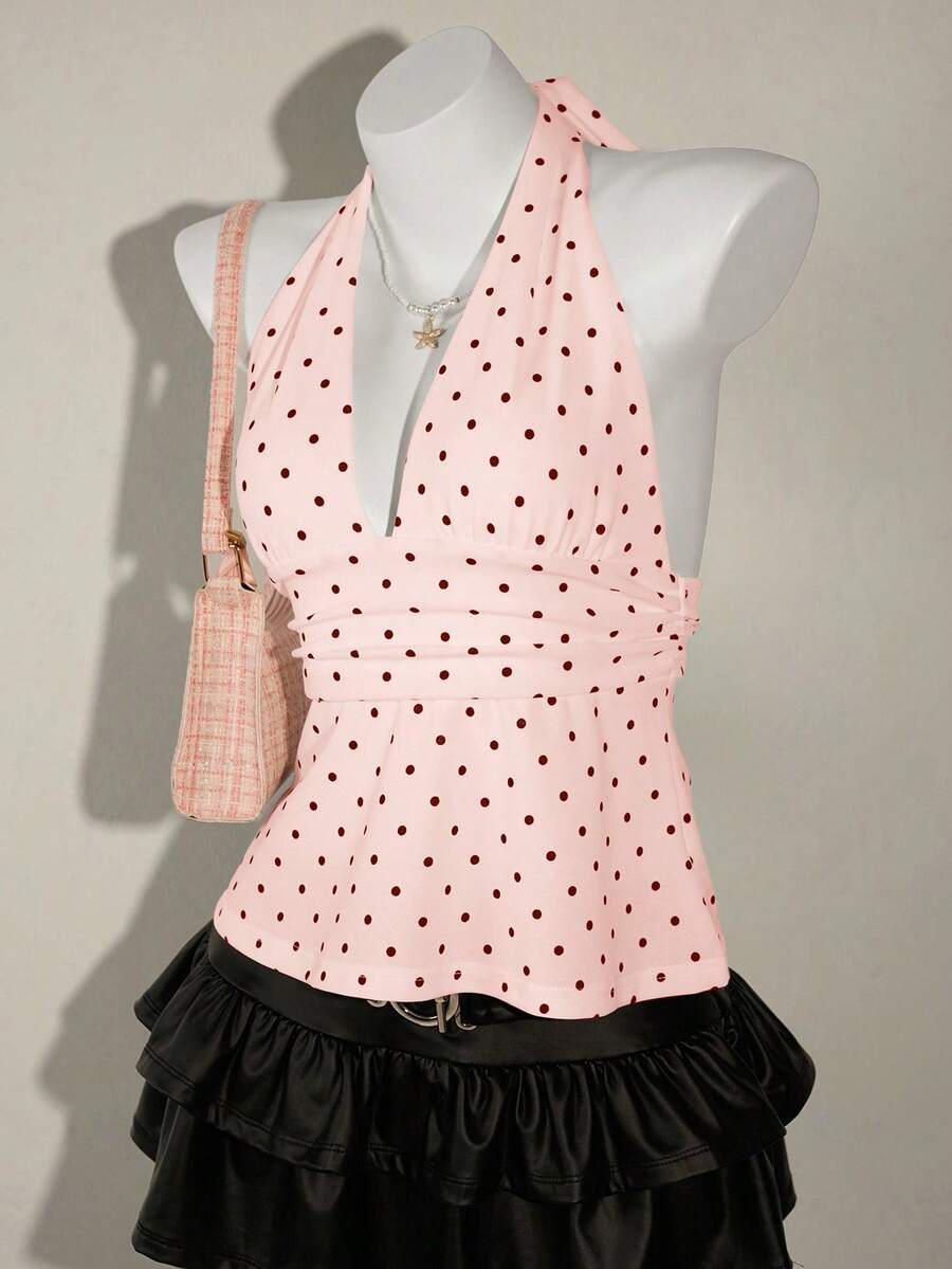 White women's deep V-neck halter tank top with ruched waist, backless design, rib-knit texture, and ruffle hem