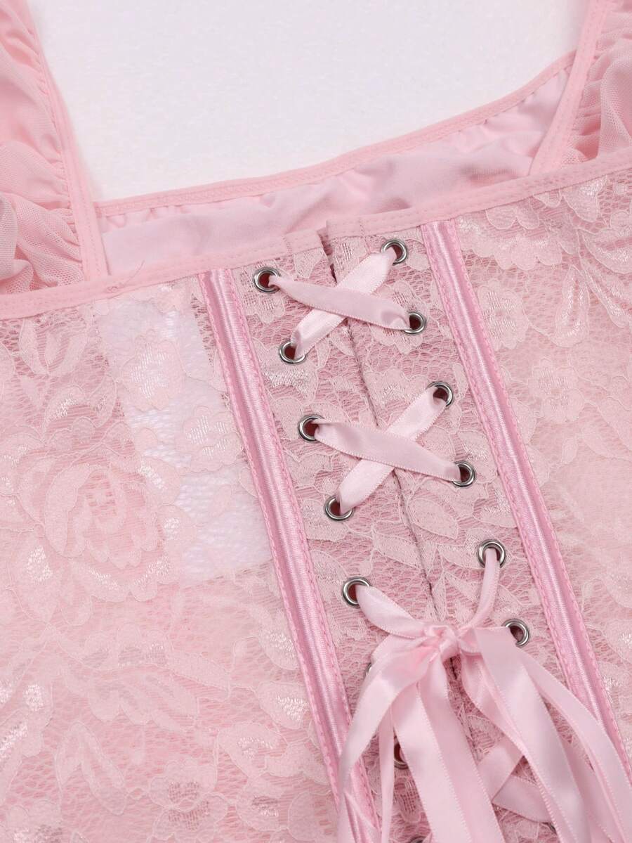 Front view of a vintage lace corset crop top featuring boned structure, square neckline, and lace-up details.