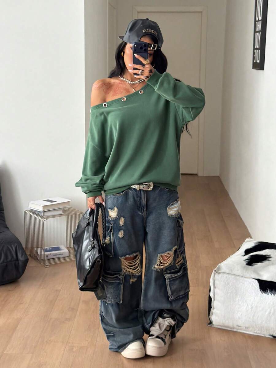 Women's sage green asymmetrical shoulder sweatshirt with button eyelet detail, drop shoulder long sleeves, and a loose casual fit.