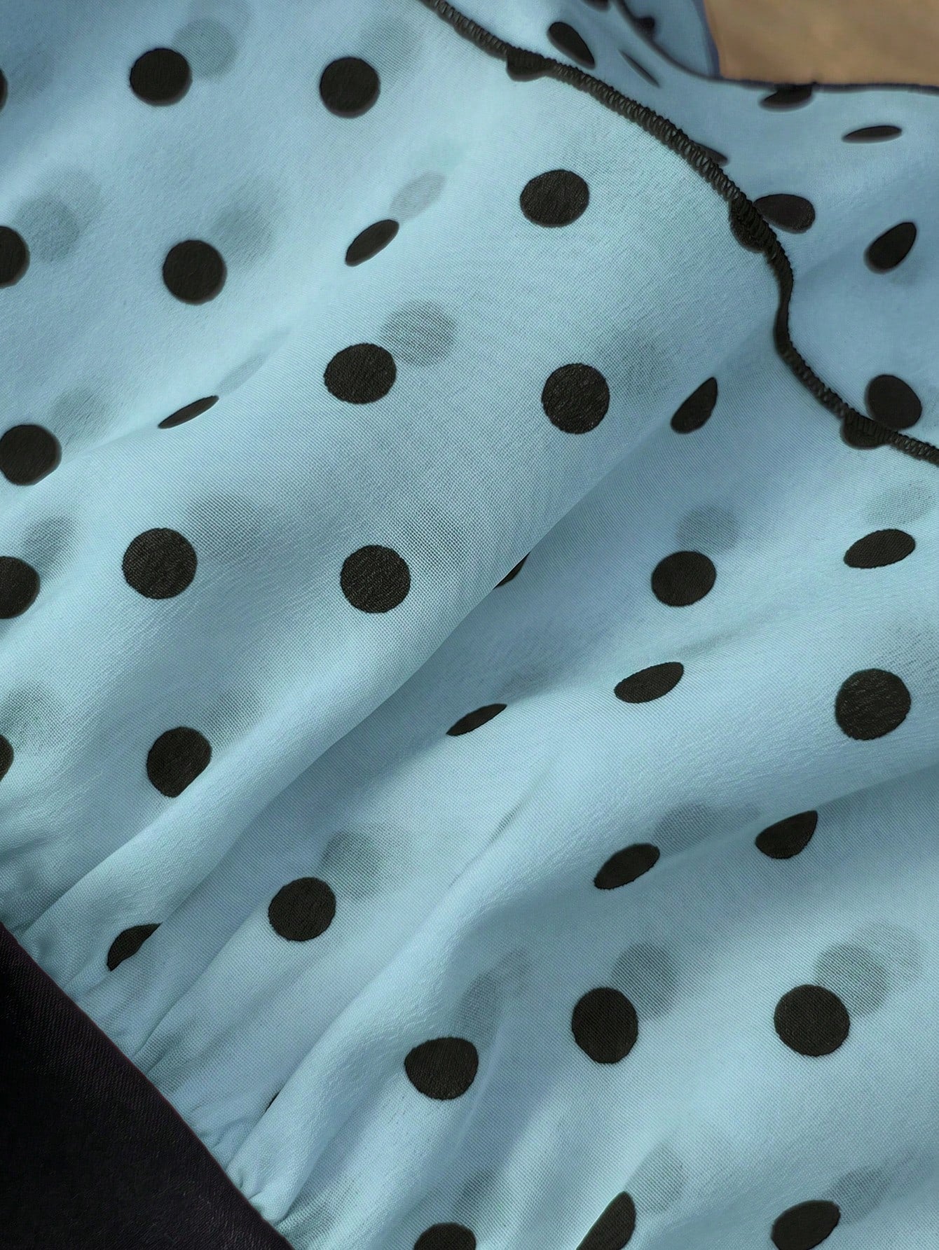Women's polka dot camisole top with contrast lace trim, tank vest neckline, slim fit, and flared ruffle hem.