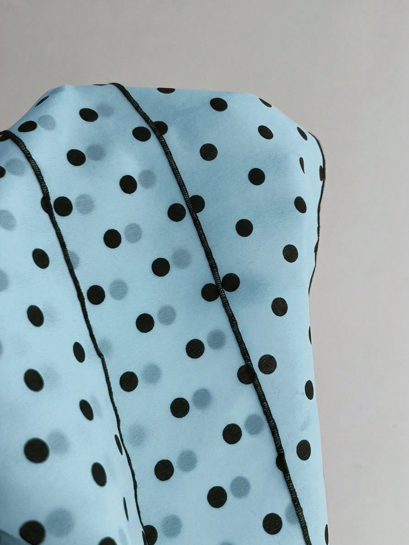 Women's polka dot camisole top with contrast lace trim, tank vest neckline, slim fit, and flared ruffle hem.