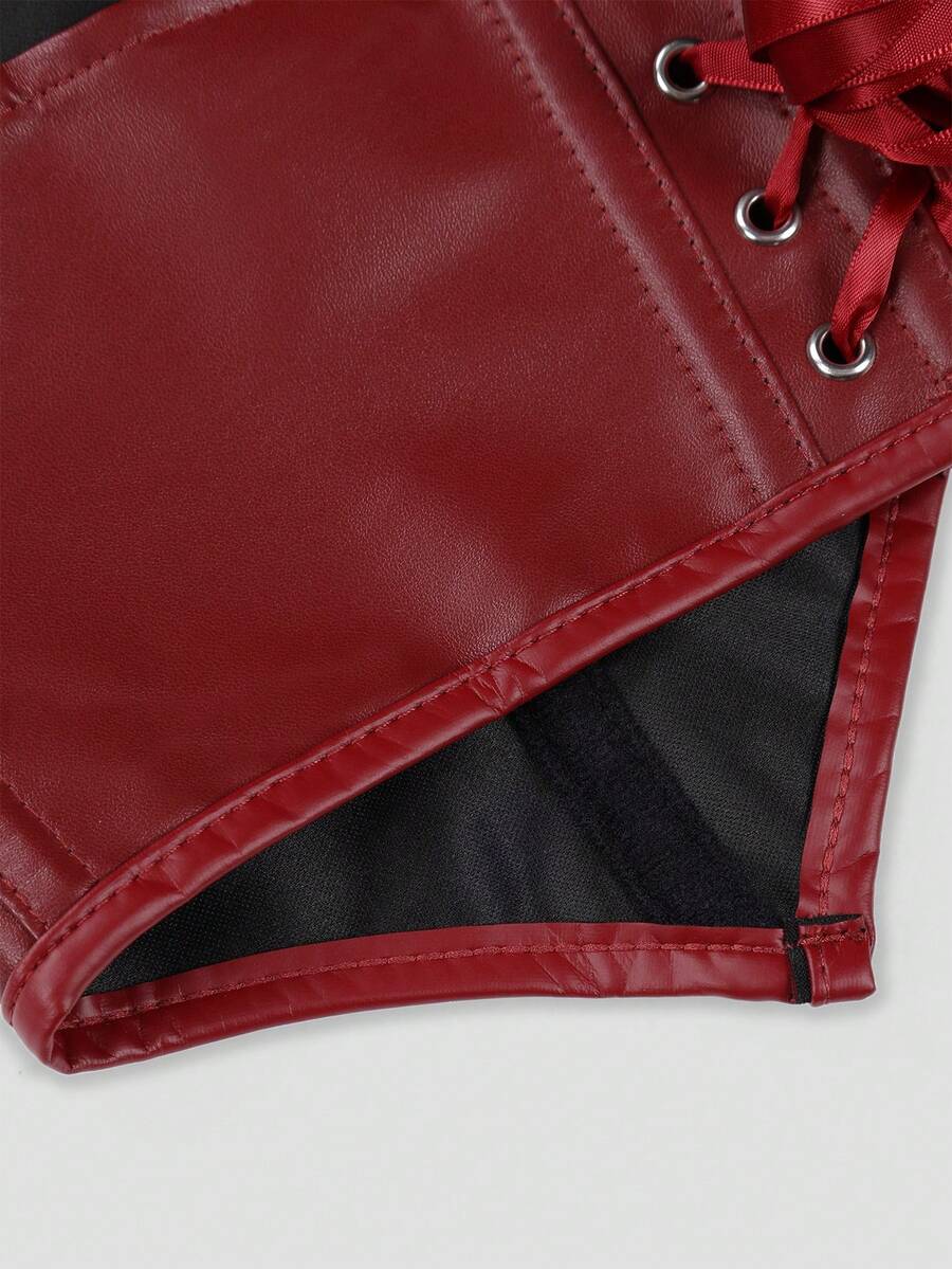 Retro PU halter tank top featuring a deep V-neck, grommet eyelet halter strap, tie back, boned details, and an asymmetrical hem.