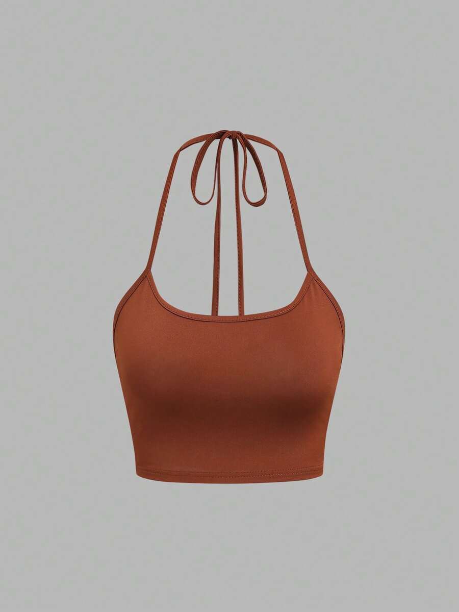 Women's striped tank top featuring an asymmetrical cold shoulder neckline and semi-sheer back.