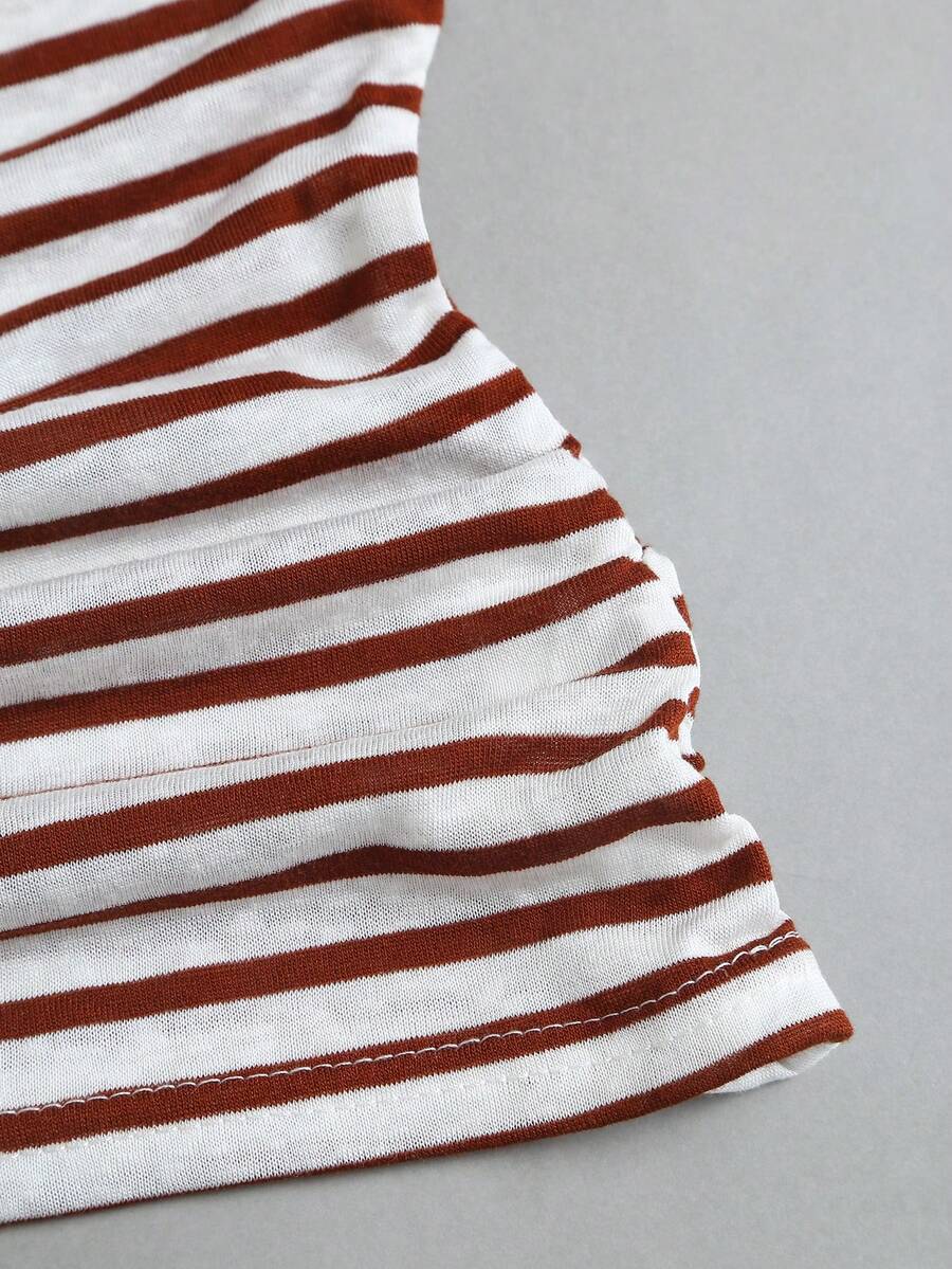 Women's striped tank top featuring an asymmetrical cold shoulder neckline and semi-sheer back.