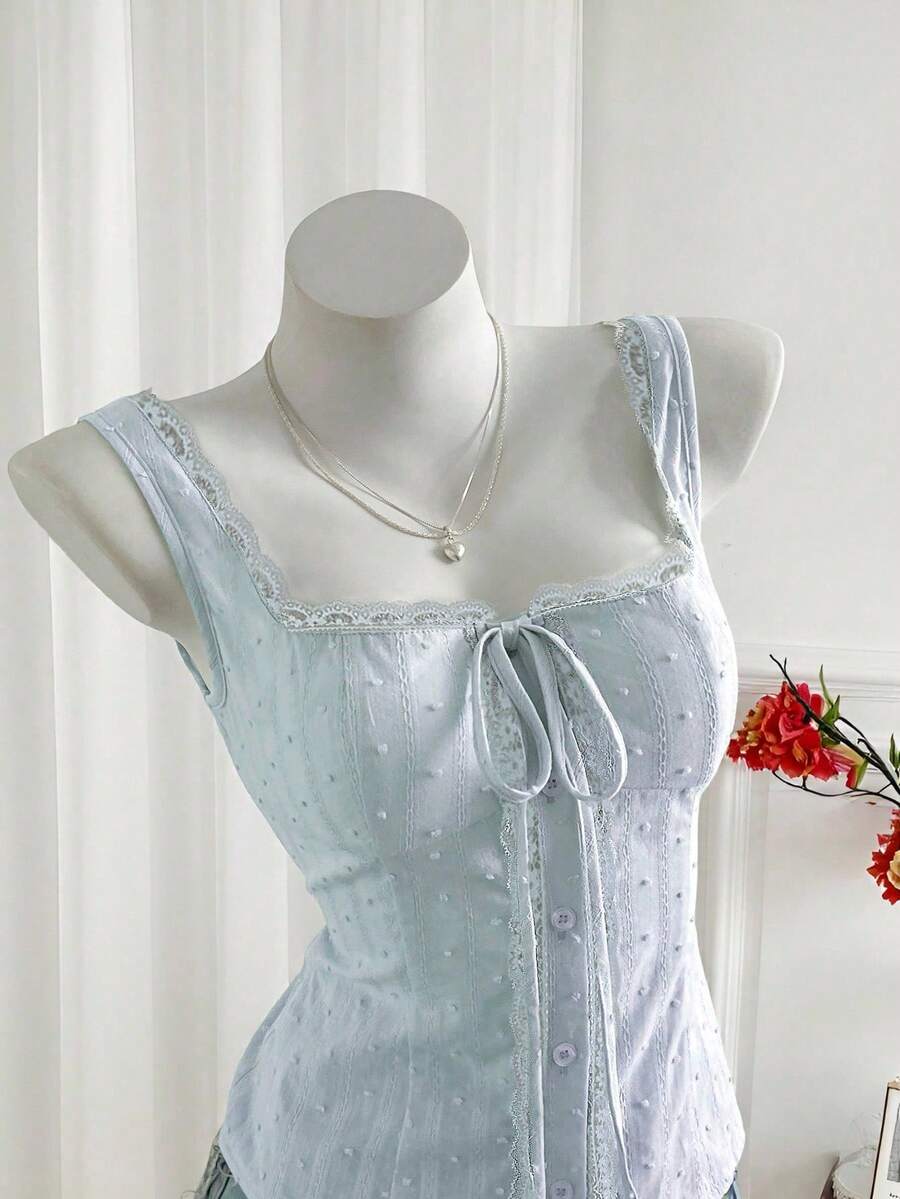 Women's 100% cotton sleeveless camisole top featuring a square neckline, wide straps, lace-up knot detail, and an asymmetrical hem.