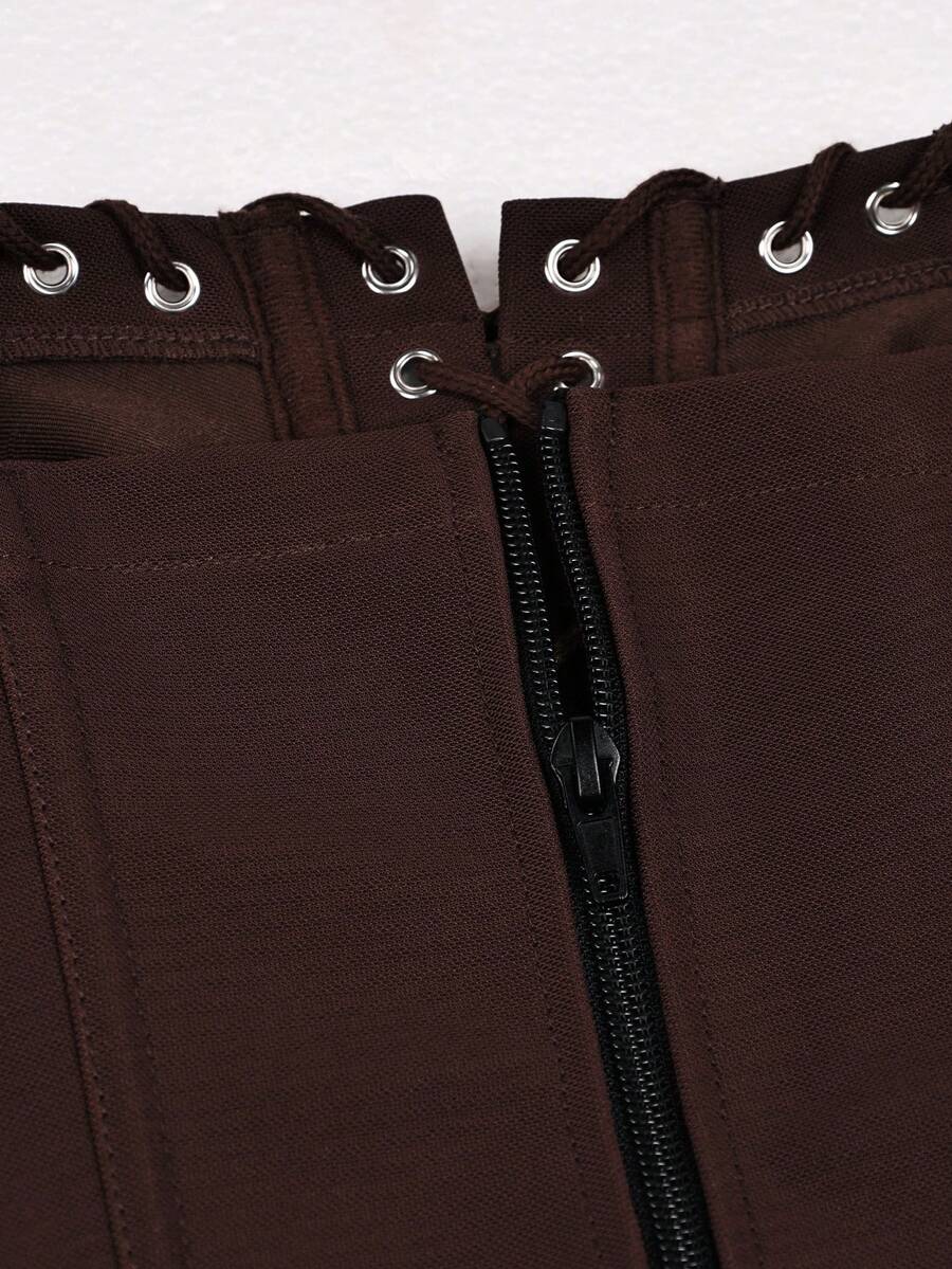 Front view of a brown punk style boned halter crop top featuring a waist strap with a metal ring, backless tie back, and sleeveless slim fit.