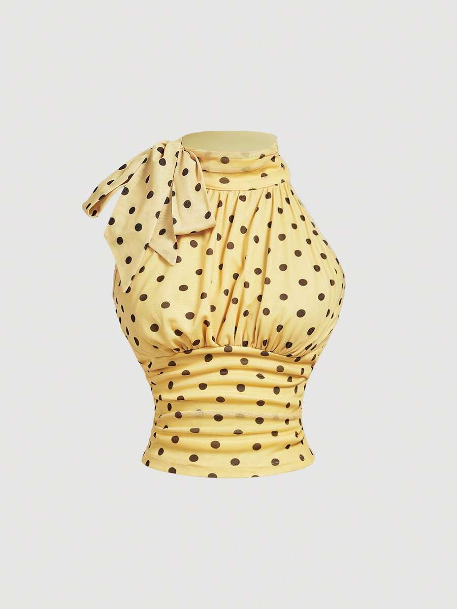 Women's sleeveless high-neck halter crop top in apricot with ruched knot front detailing.