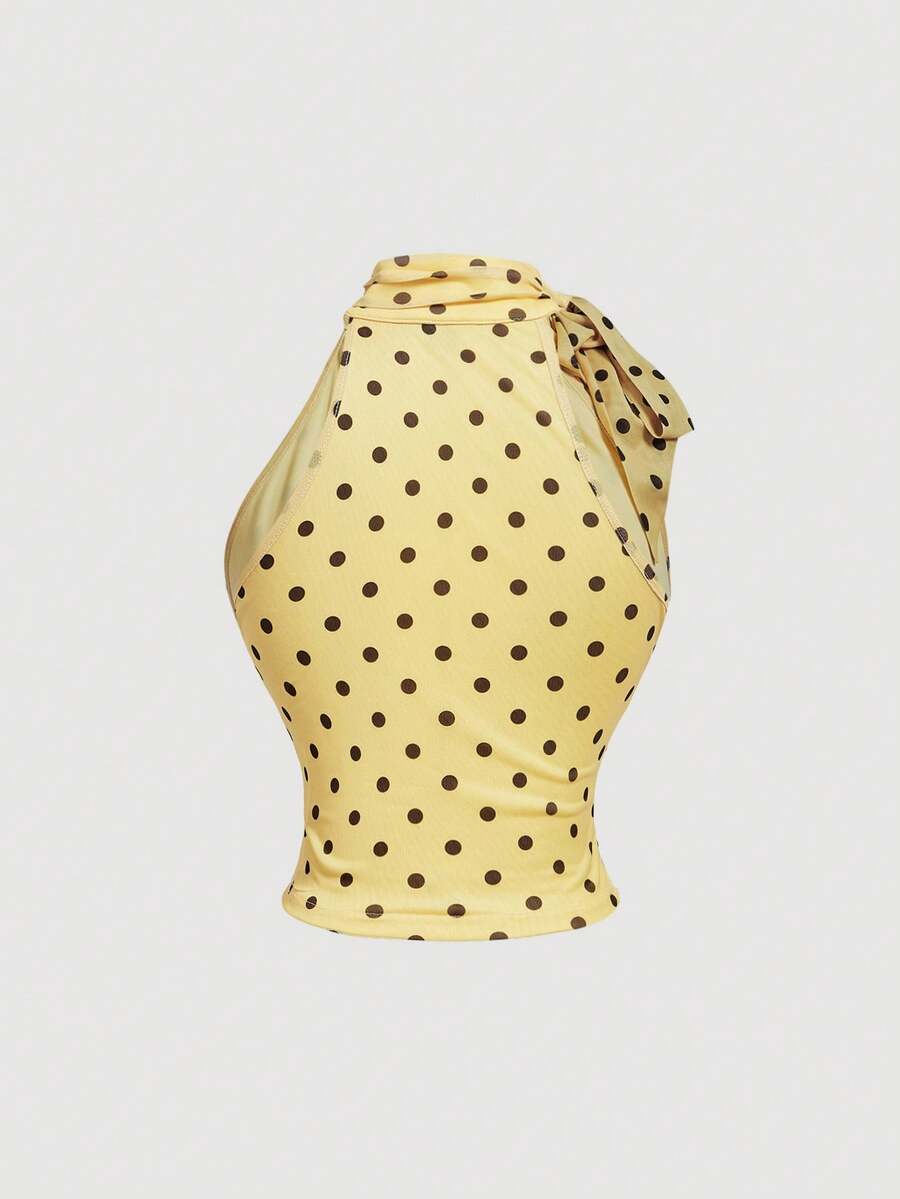 Women's sleeveless high-neck halter crop top in apricot with ruched knot front detailing.