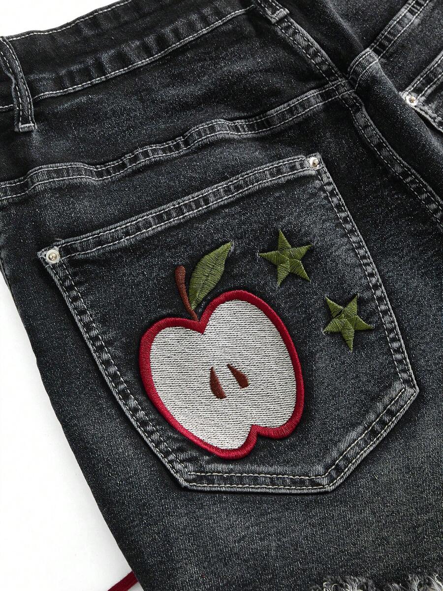 Plus size black gothic mini shorts with heart embroidery, graphic pocket pattern, lace-up detail, raw hem, and zipper fly