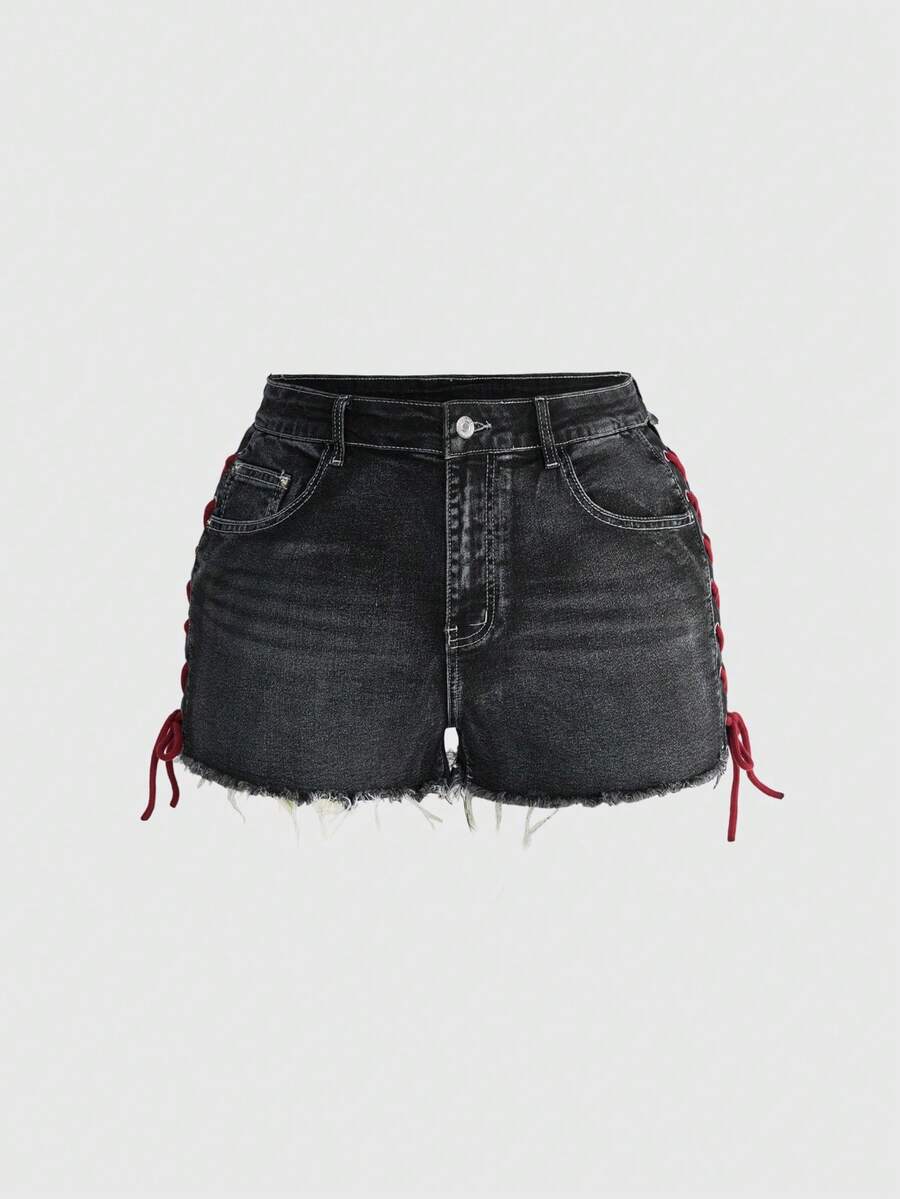 Plus size black gothic mini shorts with heart embroidery, graphic pocket pattern, lace-up detail, raw hem, and zipper fly