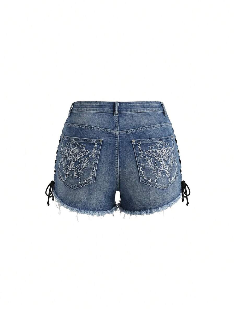 Plus size black gothic mini shorts with heart embroidery, graphic pocket pattern, lace-up detail, raw hem, and zipper fly