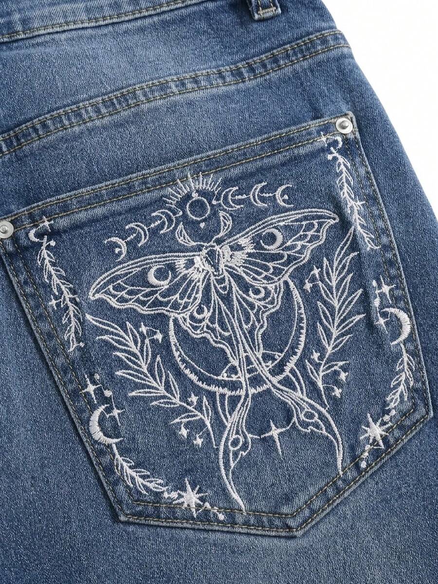 Plus size black gothic mini shorts with heart embroidery, graphic pocket pattern, lace-up detail, raw hem, and zipper fly