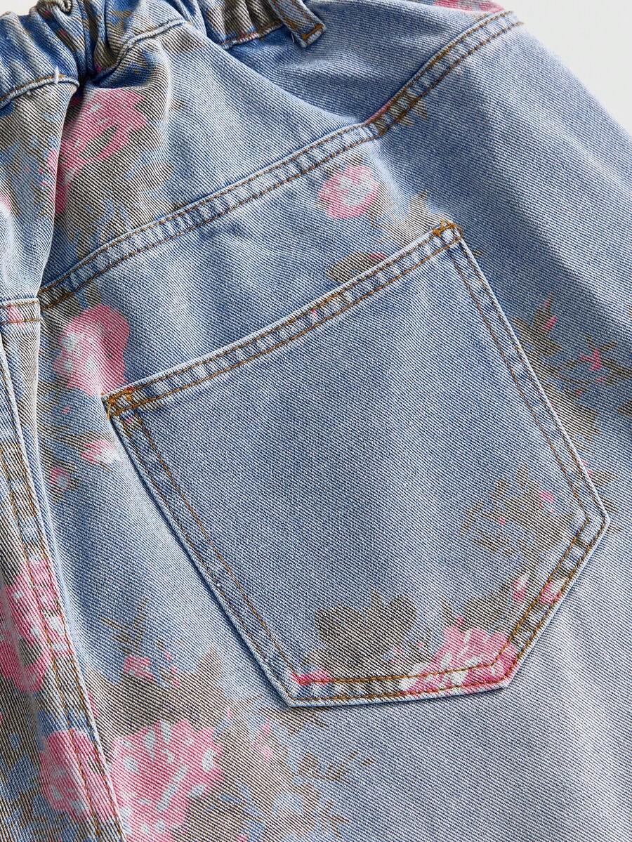 Women's loose wide-leg denim Bermuda shorts featuring vintage animal and paisley print with pockets and zipper fly.
