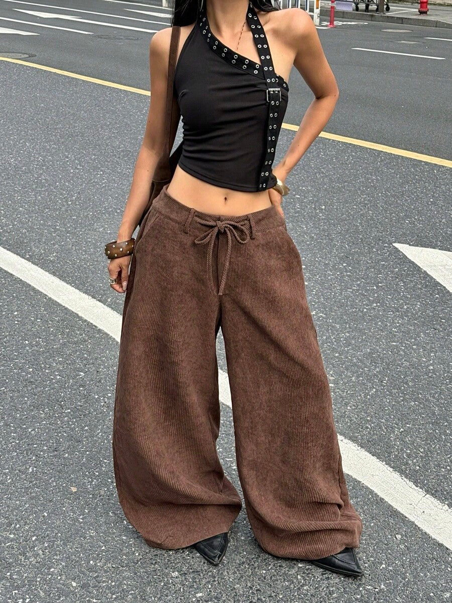 Women's casual straight leg striped woven pants featuring a low waist and zipper fly closure.