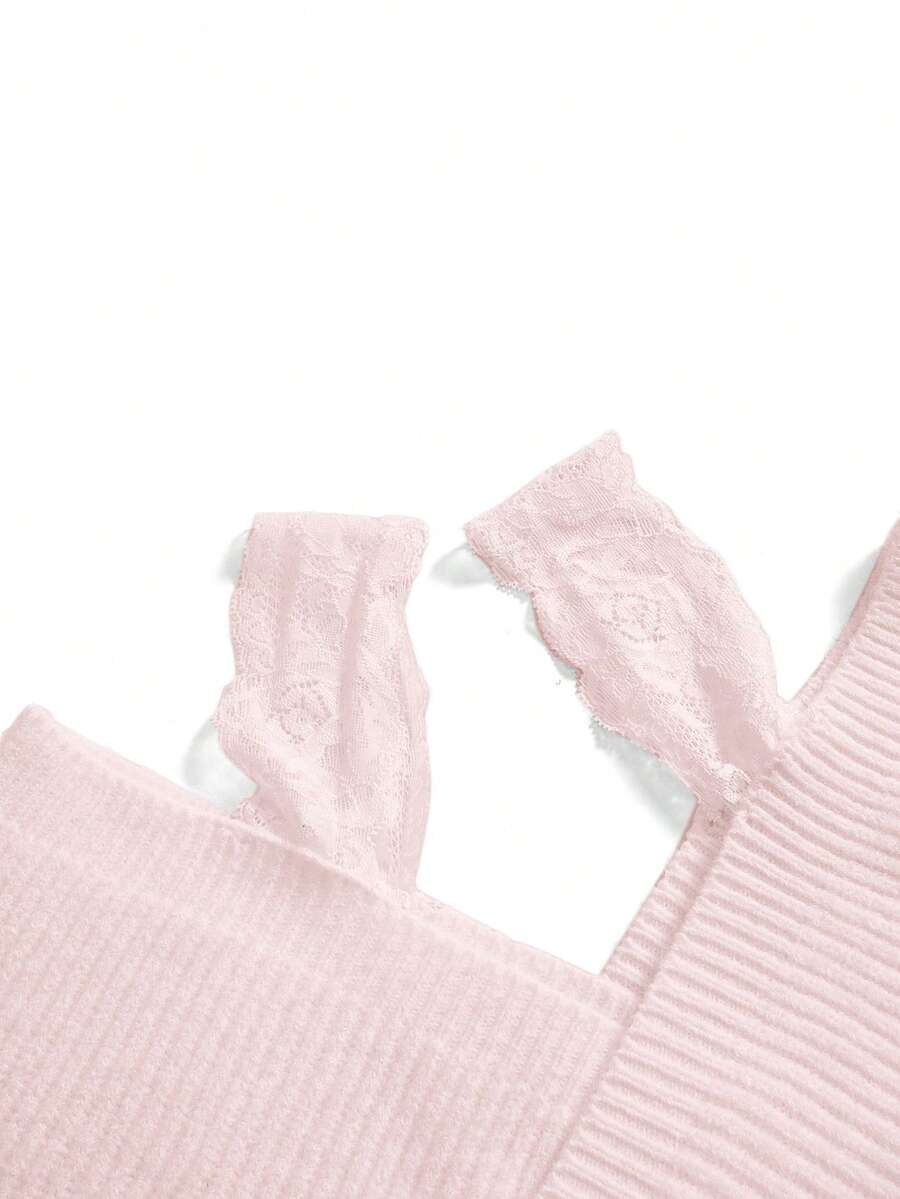 Women's two-piece rib-knit sweater set featuring a long-sleeve cold-shoulder crop top with strap details and matching wide-leg pants.