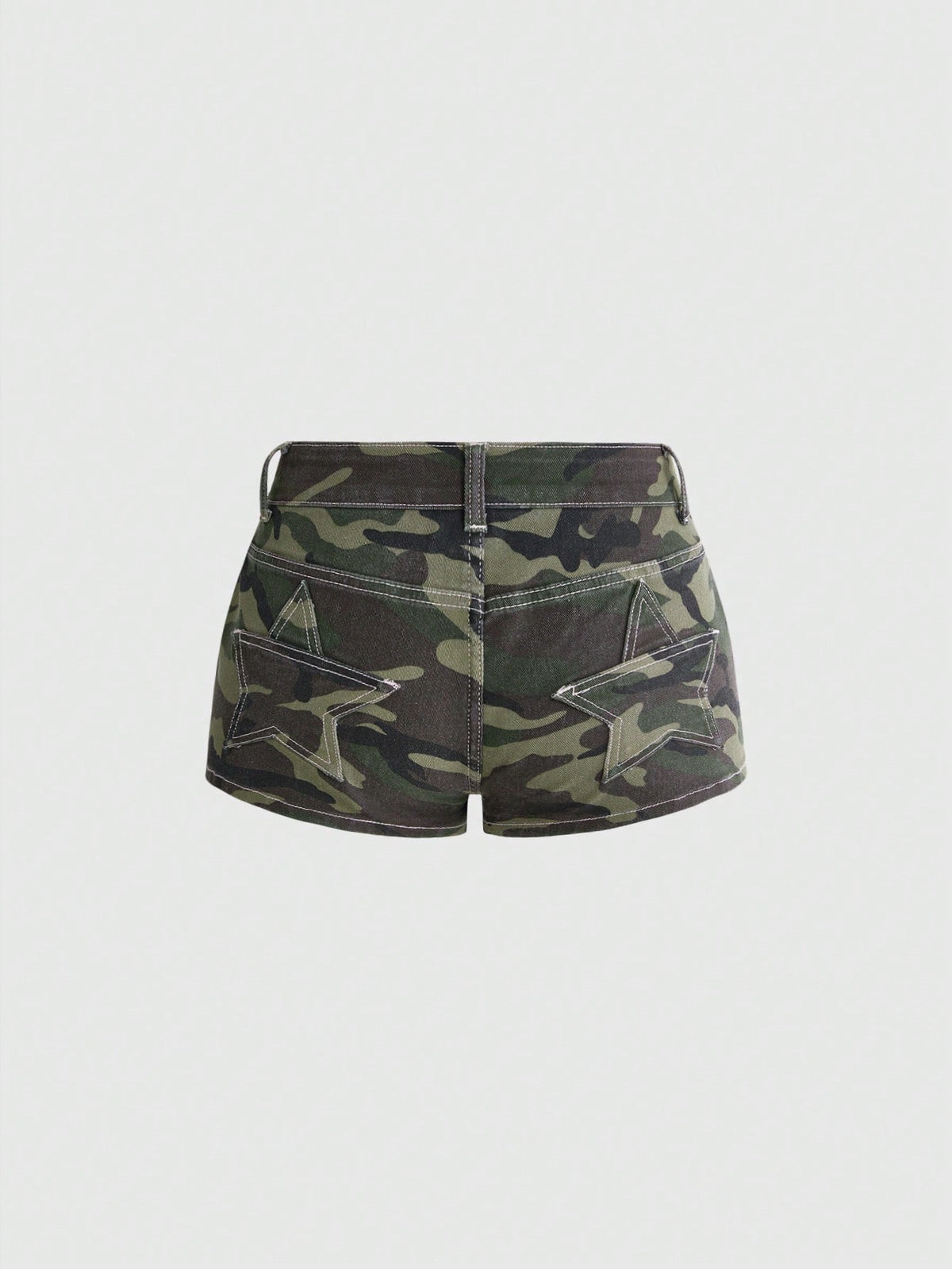 Women's ultra low waist mini shorts with back pockets, zipper fly, button detail, random print, and star patch in a grunge punk Y2K style.