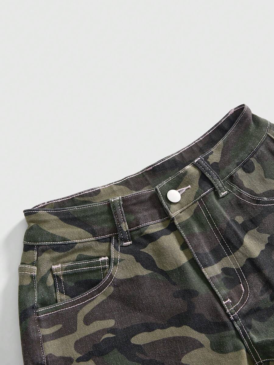 Women's ultra low waist mini shorts with back pockets, zipper fly, button detail, random print, and star patch in a grunge punk Y2K style.
