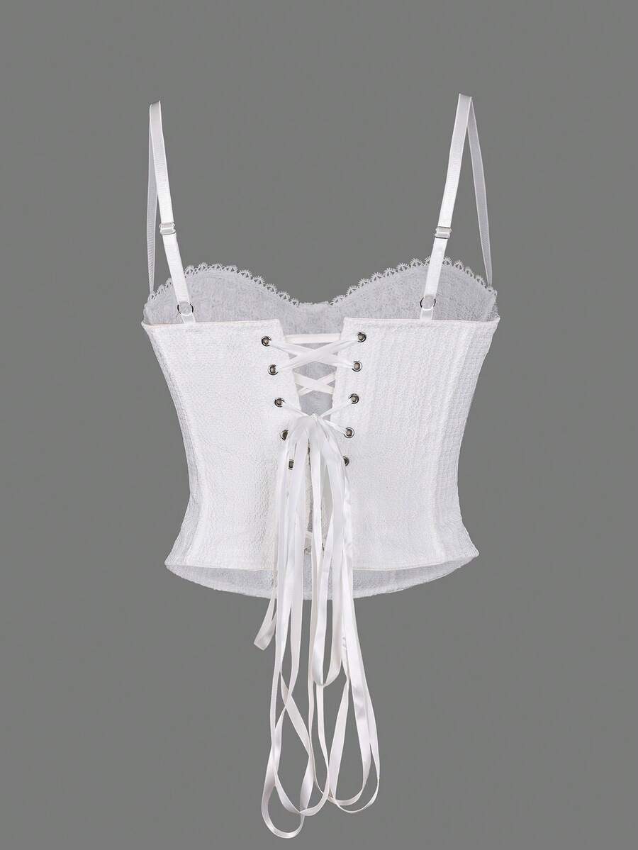 White elegant corset top with lace trim, cup details, adjustable spaghetti straps, and a back tie with grommet eyelets.