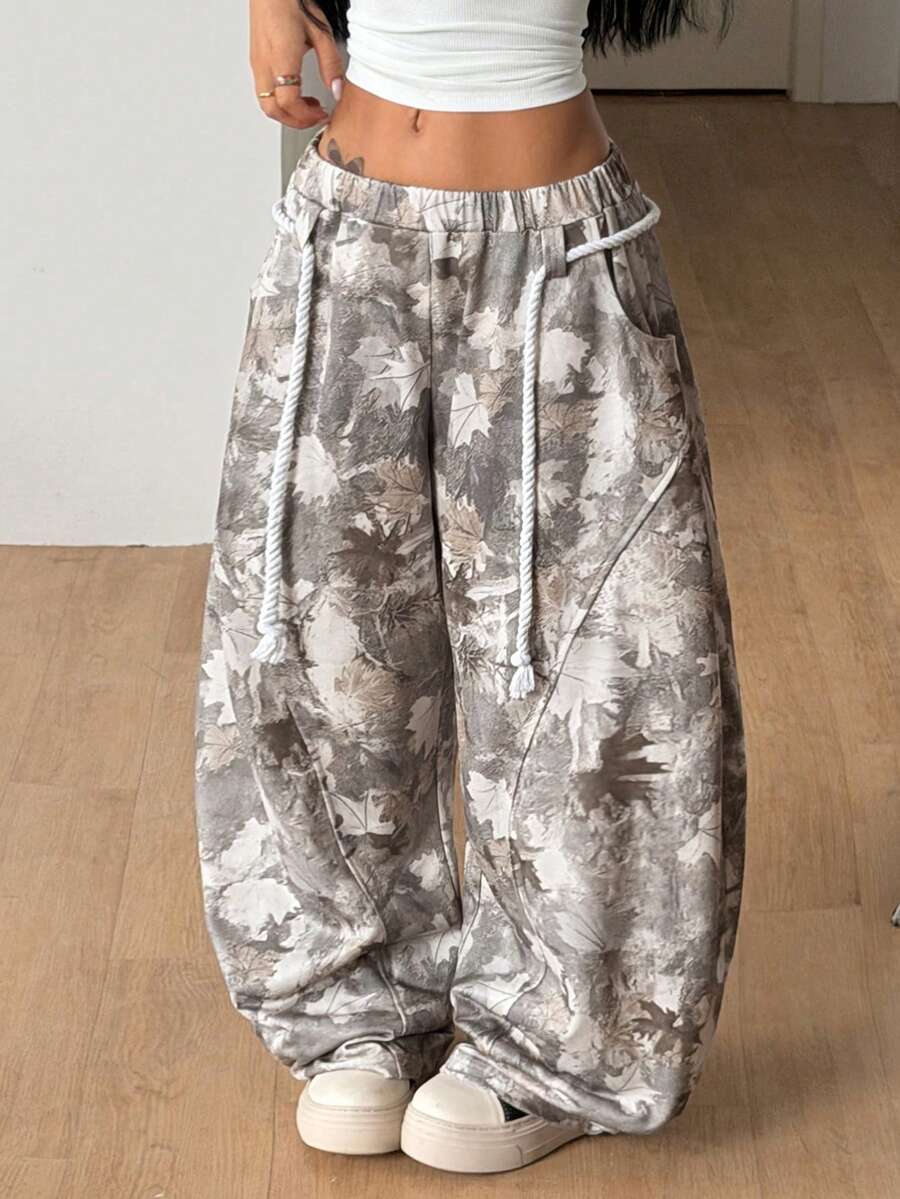 Women's casual grey plaid sweatpants featuring an elastic drawstring waistband, side pockets, and a relaxed loose fit.