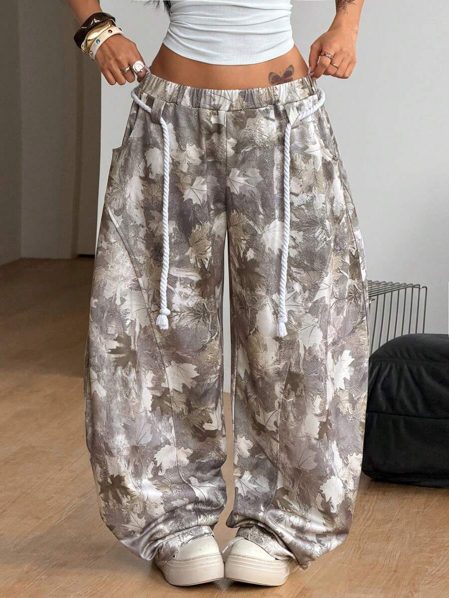 Women's casual grey plaid sweatpants featuring an elastic drawstring waistband, side pockets, and a relaxed loose fit.