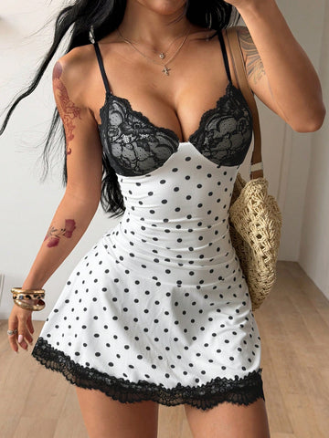 Women's black and white polka dot cami mini dress with contrast lace trim, spaghetti straps, and slim pencil fit.
