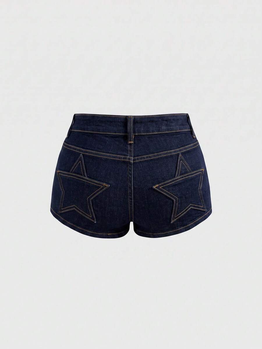 Women's ultra low waist mini shorts with back pockets, zipper fly, button detail, random print, and star patch in a grunge punk Y2K style.