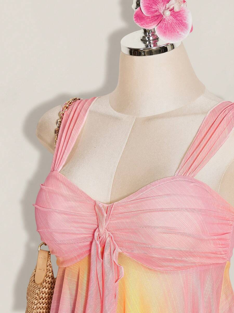 Women's pink semi-sheer mesh camisole with straps, slim fit, asymmetrical ruffle hem, drawstring, and knot details