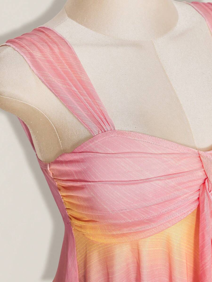 Women's pink semi-sheer mesh camisole with straps, slim fit, asymmetrical ruffle hem, drawstring, and knot details