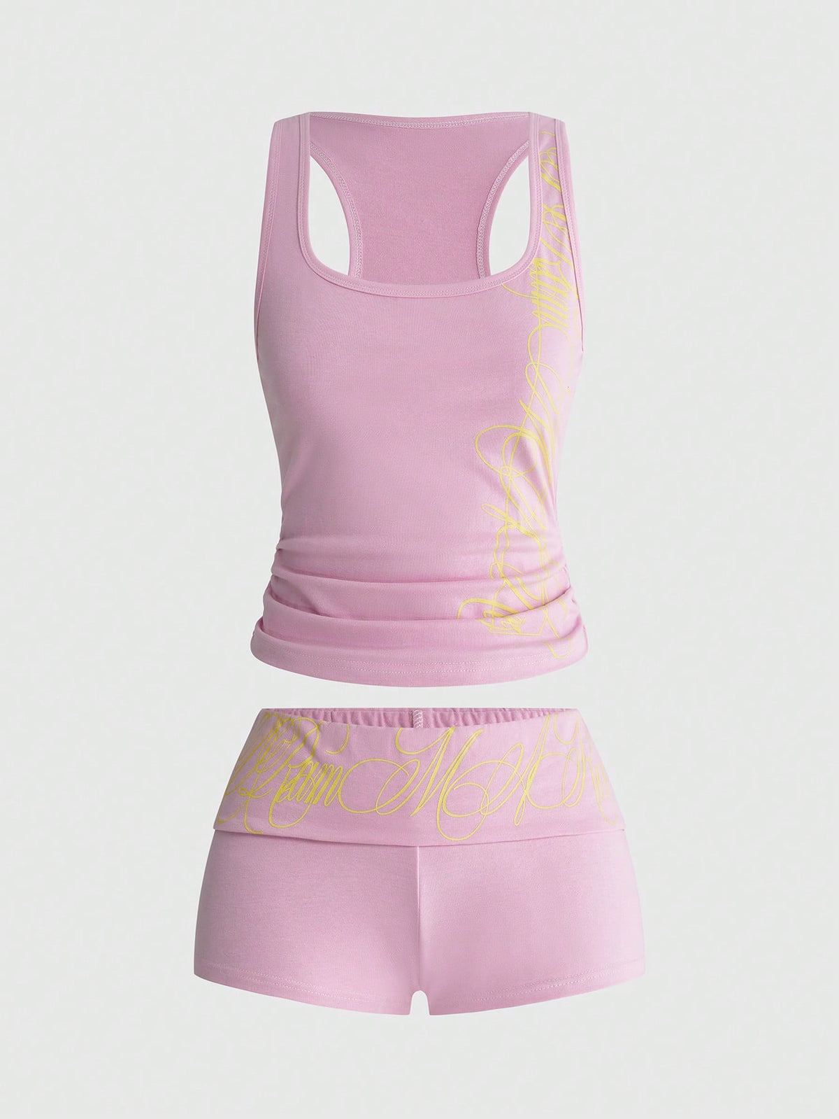 Punk-inspired two-piece set with a fitted scoop neck slogan tank top featuring cross and rhinestone details paired with ultra low waist mini shorts.