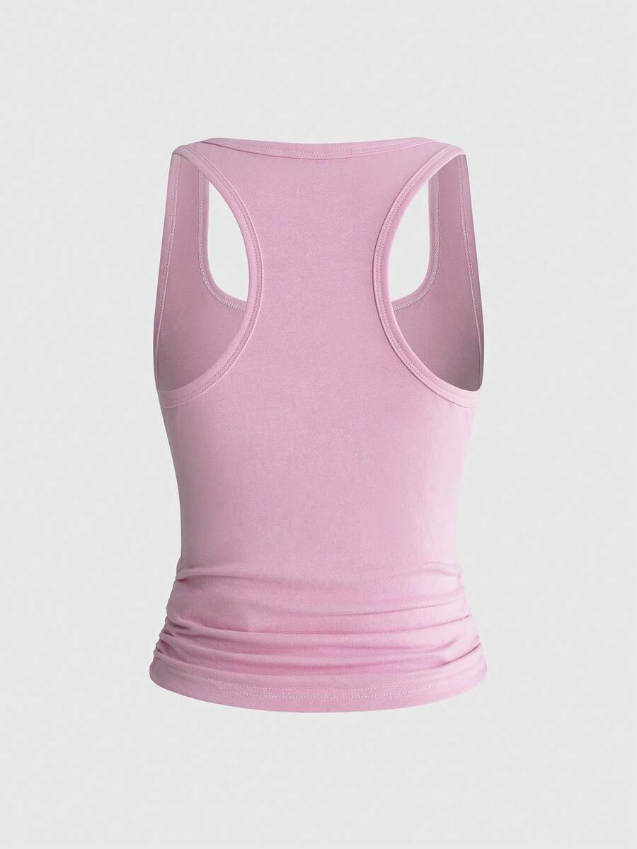 Punk-inspired two-piece set with a fitted scoop neck slogan tank top featuring cross and rhinestone details paired with ultra low waist mini shorts.