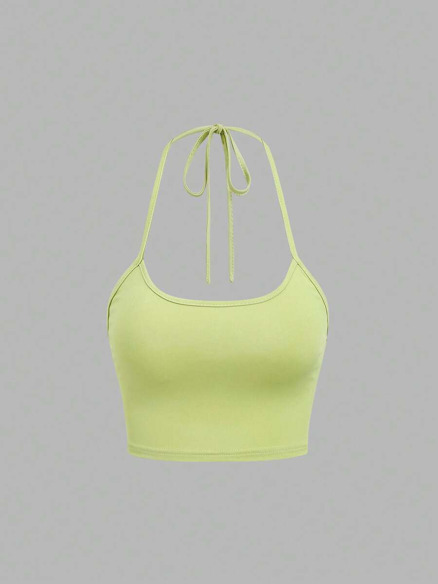Women's striped tank top featuring an asymmetrical cold shoulder neckline and semi-sheer back.