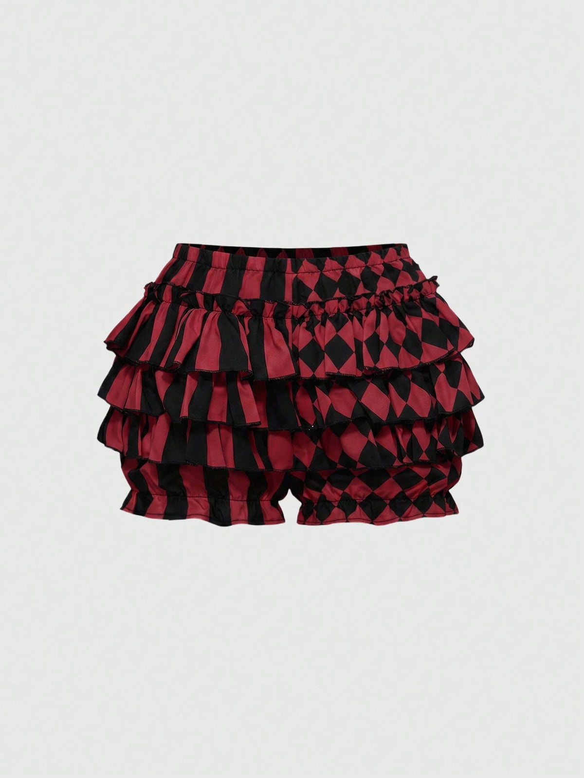 Black and white striped and geometric patchwork gothic pumpkin shorts for women featuring tiered ruffle hems and an elastic waistband.