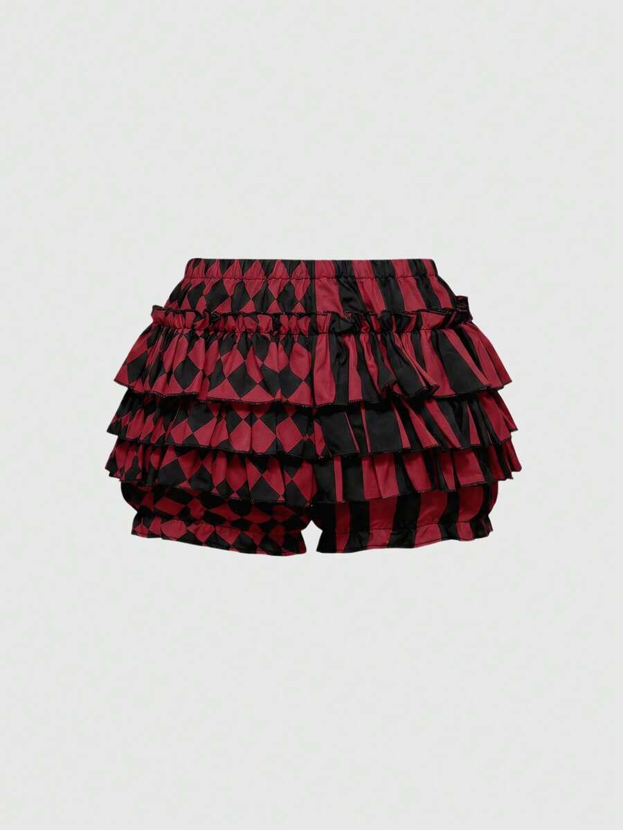 Black and white striped and geometric patchwork gothic pumpkin shorts for women featuring tiered ruffle hems and an elastic waistband.