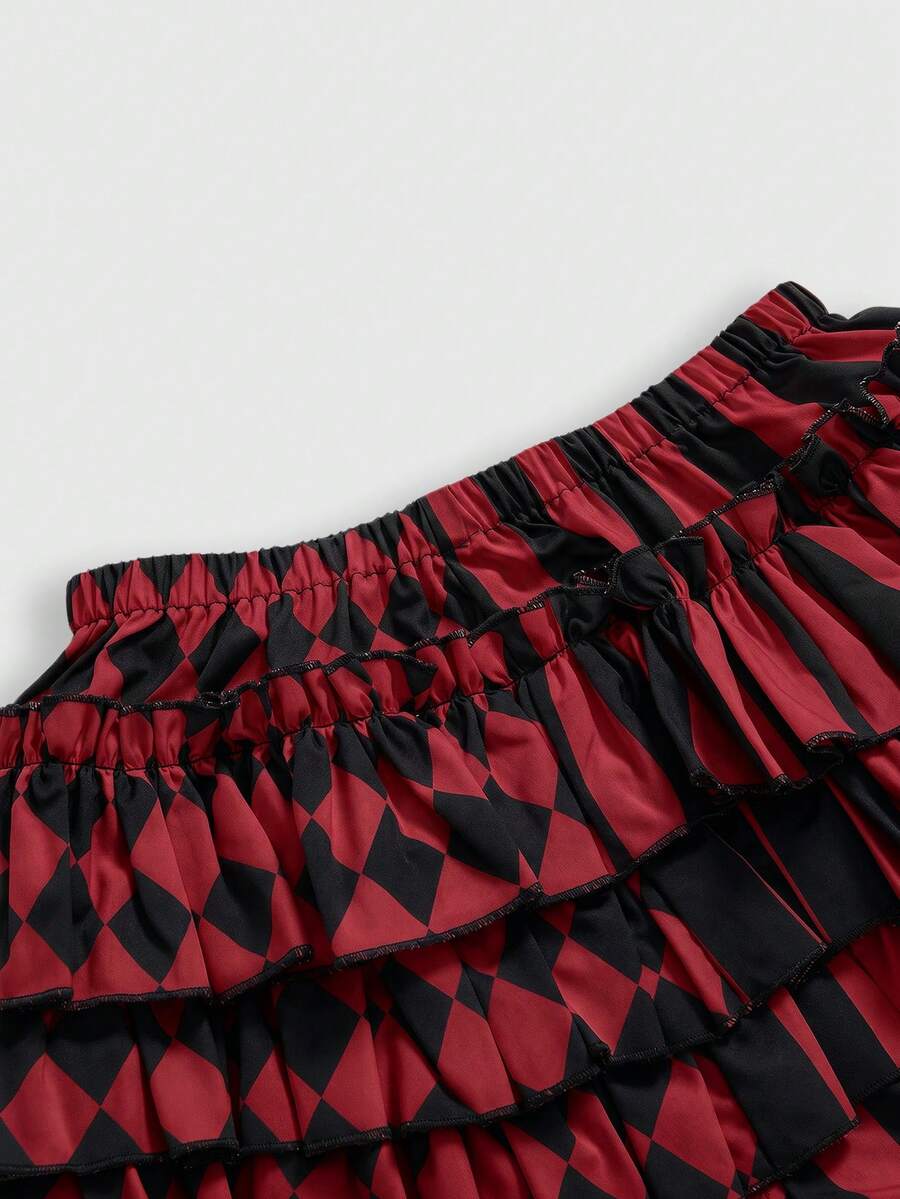 Black and white striped and geometric patchwork gothic pumpkin shorts for women featuring tiered ruffle hems and an elastic waistband.