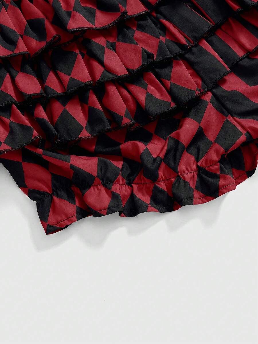 Black and white striped and geometric patchwork gothic pumpkin shorts for women featuring tiered ruffle hems and an elastic waistband.