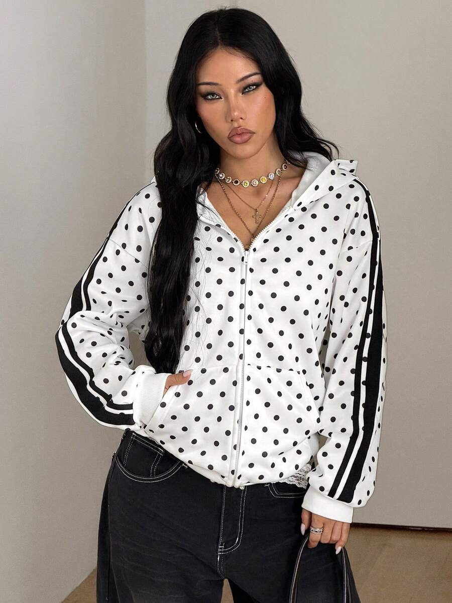 Women's army green camo zip up hoodie with drop shoulder sleeves, front pockets, and drawstring hood